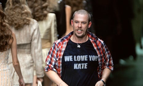 (Alexander McQueen shows his support for Kate Moss at the end of his ready-to-wear spring/summer show in 2010.