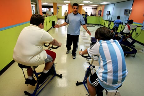 Puerto Rican children train on stationary bikes inside the gym in Guaynabo, Puerto Rico.