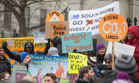 Environmentalists rally in Boston to demand state legislators support a bill that would require divestment from the state's fossil fuel holdings