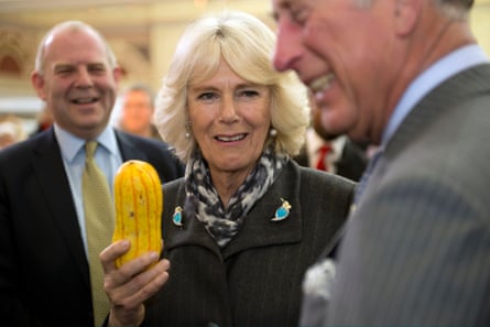 Camilla, Duchess of Cornwall and Prince Charles share a joke as Raymond Blanc looks on during the 2014 Edible Garden Show.