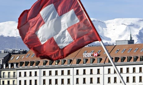 A Swiss flag flies above a HSBC logo