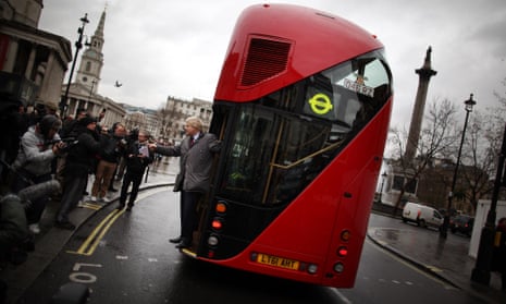 London Mayor Boris Johnson waves from a new prototype red double decker bus at Trafalgar Square in London in 2011.
