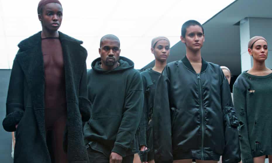 Kanye West with models during the  showing of the Kanye West Adidas Fall 2015 collection.