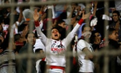 In this Sunday, Feb. 8, 2015 photo, an Ultras White Knights soccer fan cries during a match between Egyptian Premier League clubs Zamalek and ENPPI at the Air Defense Stadium in a suburb east of Cairo, Egypt. Egypt's Cabinet has indefinitely suspended the national soccer league after more than 20 fans were killed in a stampede and clashes with police outside the Cairo stadium. (AP Photo/Ahmed Abd El-Gwad, El Shorouk Newspaper) EGYPT OUT pdl9