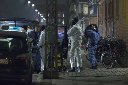 Police officers work at the area around the Krudttønden cafe in Copenhagen where shots were fired during a debate on Islam and free speech.