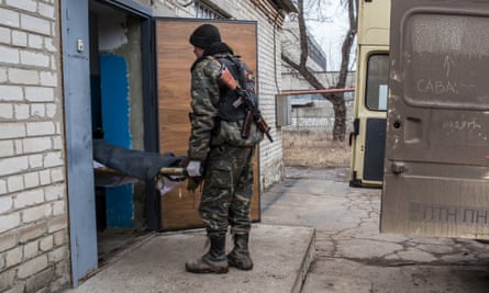 The body of a Ukrainian soldier killed in fighting is brought into the morgue on 14 February in Artemivsk.