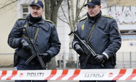 Danish police secure the scene near where the suspect was shot dead early on Sunday.