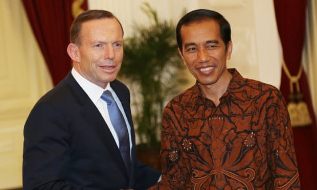 Indonesia's President Joko Widodo, meets with Australian Prime Minister Tony Abbott, left, at the presidential palace in Jakarta, Indonesia, Monday, Oct. 20, 2014.