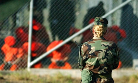 A soldier from the US Army watches over detainees in Guantánamo Bay