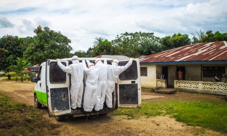 Health workers transport a person suspected to have died of Ebola in Port Loko, on the outskirts of Freetown.