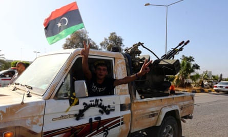 A Libyan Dawn fighter appears in a victorious mood at the entrance of Tripoli international airport in August 2014 following clashes with allies of rogue general Khalifa Haftar.