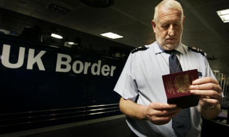 Passports are checked at Gatwick airport in West Sussex.