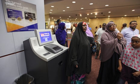 Members of the Somali community wait to speak a bank manager in Minnesota.