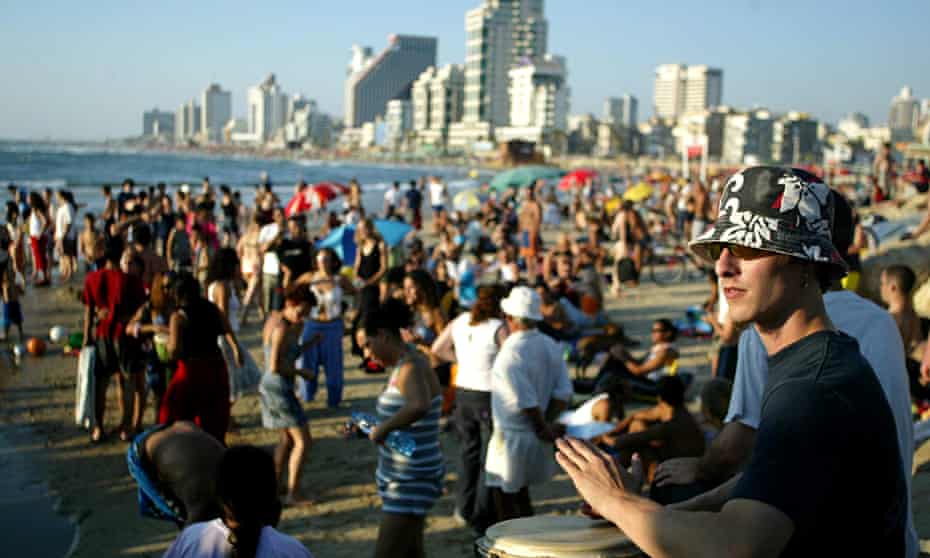 Israelis on the beach in Tel Aviv