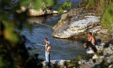 Fishermen cast their lines in Vjosa river, near the city of Permet, Albania