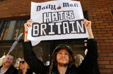 A demonstrator outside the Daily Mail offices responds to its attack on Ralph Miliband