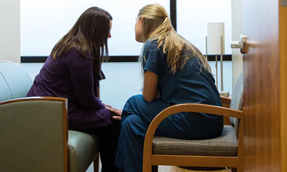 Woman discussing her choices with a health care professionals