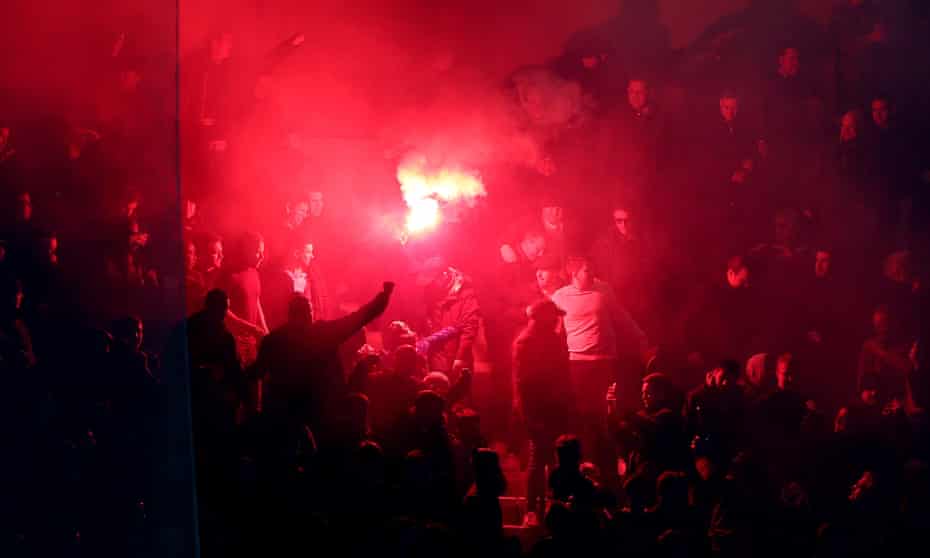 Chelsea fans let off a flare during Tuesday's match in Paris.