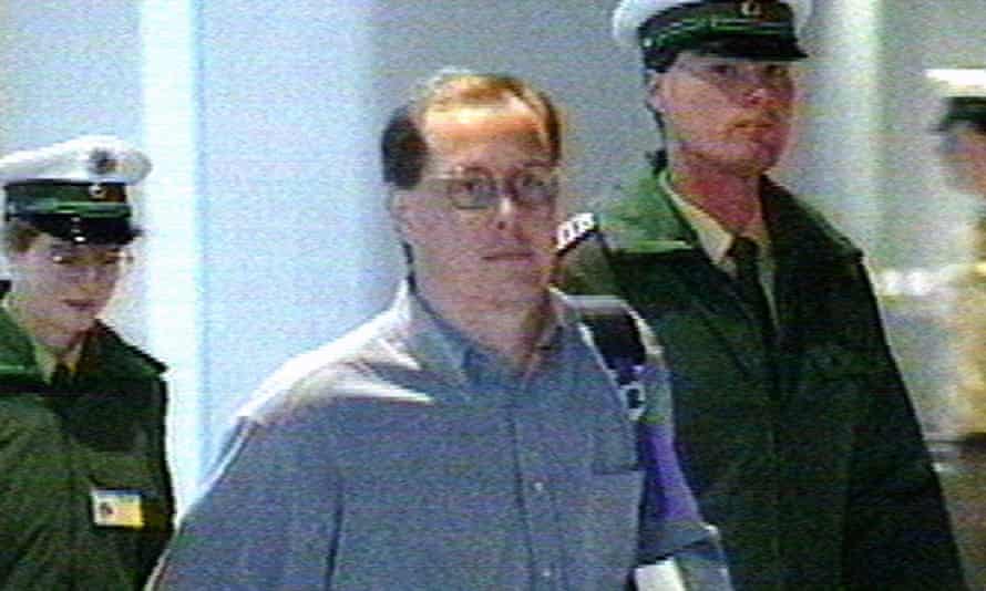 Nick Leeson is escorted by officials at Frankfurt airport after an international manhunt tracked him down in 1995