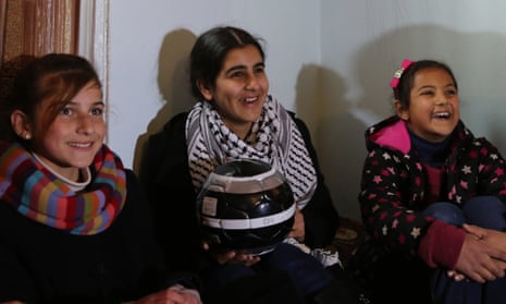 Malak al-Khatib, centre, with two friends the day after she was released from Israeli prison.