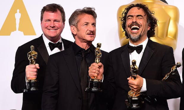 (left to right) Producer James W. Skotchdopole, Sean Penn and producer/director Alejandro G Inarritu backstage at the Oscars.