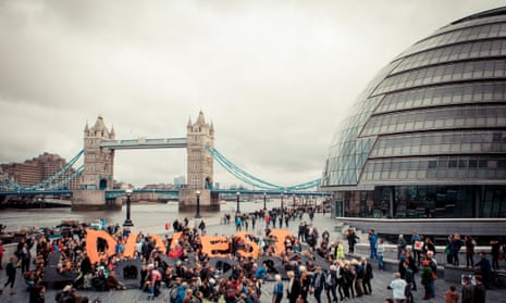 People gathered outside City Hall, London, as part of global day of action against fossil fuels, Saturday February 14, 2015.