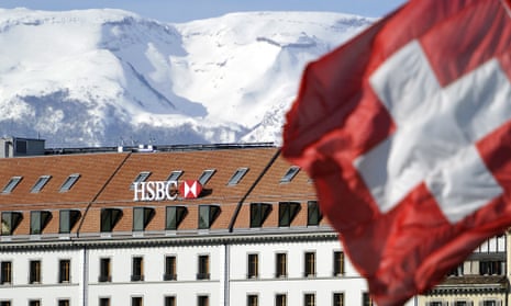 A Swiss flag flies above HSBC offices in Geneva