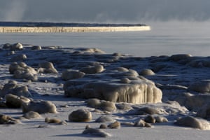 Ice forms along the shore on Lake Michigan