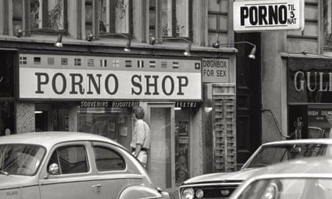 A man observes the window of a porn shop in Copenhagen in 1969.