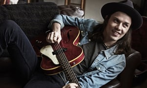James Bay looking relaxed and happy with his guitar