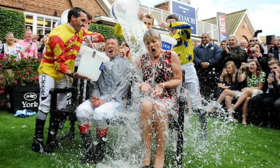 Frankie Dettori and Clare Balding take part in the Ice Bucket Challenge during the 2014 Welcome To Yorkshire Ebor Festival at York Racecourse, York.