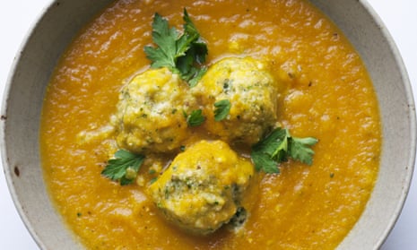 Nigel Slater's recipe for carrot and cardamom soup with 3 herb ricotta dumplings in a bowl
