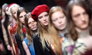 Models parade at the end of the Gucci’s first womenswear show under Alessandro Michele at Milan fashion week.