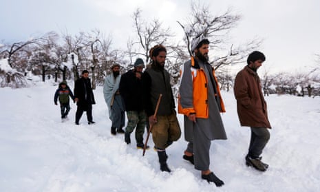 Relatives of avalanche victims return after conducting a search for the victims in Panjshir.
