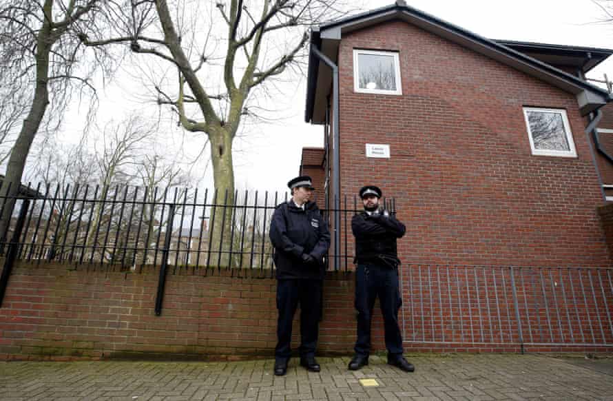 Police outside flats in west London believed to be where Mohammed Emwazi used to live.