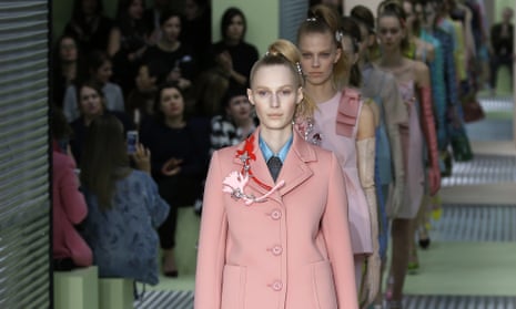 Models wear creations for Prada women's autumnl-winter 2015 collection at Milan fashion week.
