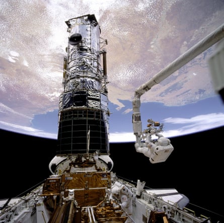 Hubble being fixed serviced astronauts