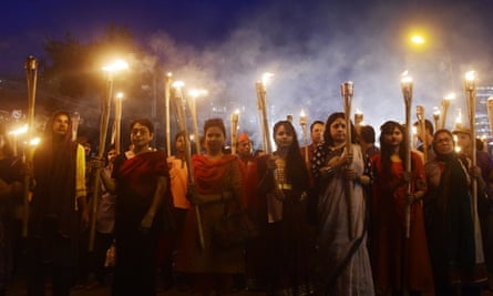 Bangladeshi secular activists take part in a torch-lit protest against the killing of Avijit Roy
