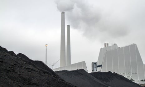 A mound of coal used to fuel Dong Energy's Avedore 1, a coal-fired CHP power plant is seen stored at the company's Avedoerevaerket site in Hvidore, Denmark, on October 15, 2013. Dong Energy A/S, Denmark's largest utility is selling shares as part of a financial restructuring announced in February to cut costs, reduce debt and bolster investments in oil and gas exploration as well as wind farms.