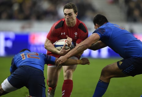 Wales' wing George North tries to break through the French defence.