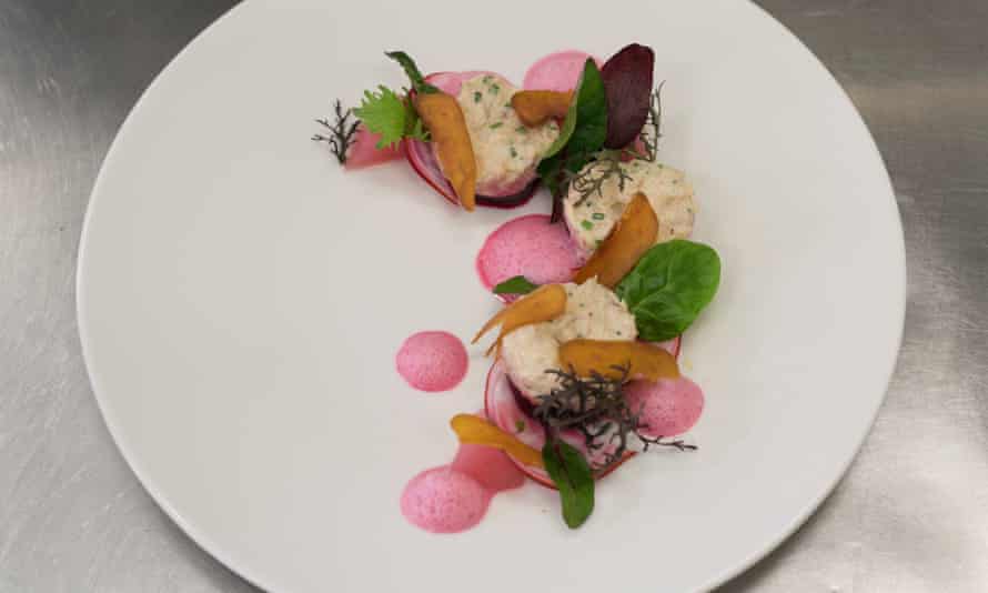 Multi-coloured crab with beetroot and artichoke.