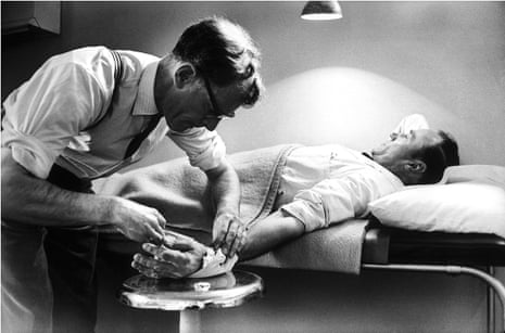 John Sassall treating patients.