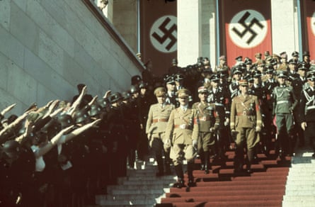 Hitler and his Nazi party officials walk at the 1938 Nuremberg rally.