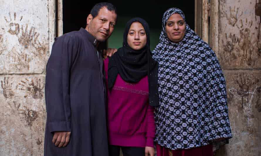 Mansoura Mohamed with her husband Ragab and daughter, Ghada, near their home in Assiut, Egypt. Ghada will not undergo FGM.