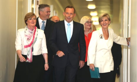 The PM Tony Abbott with deputy Julie Bishop on their way to the government party room meeting this morning in Parliament House.