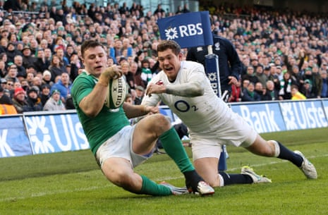 Robbie Henshaw touches down the ball to score the opening try despite the efforts of Alex Goode.