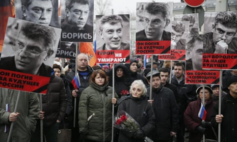 Portraits of Boris Nemtsov are held by marchers in Moscow. Russia
