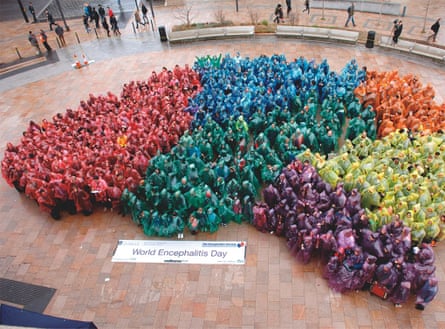 A human brain made up of people in coloured cagoules, organised by Tom Solomon to publicise encephalitis
