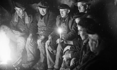 1940s miners take a break down a Welsh slate mine.