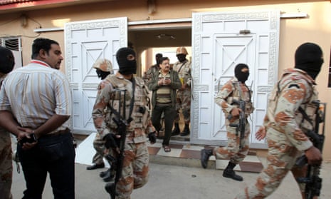 Pakistani paramilitary troops raid the Muttahida Quami Movement's offices in Karachi.